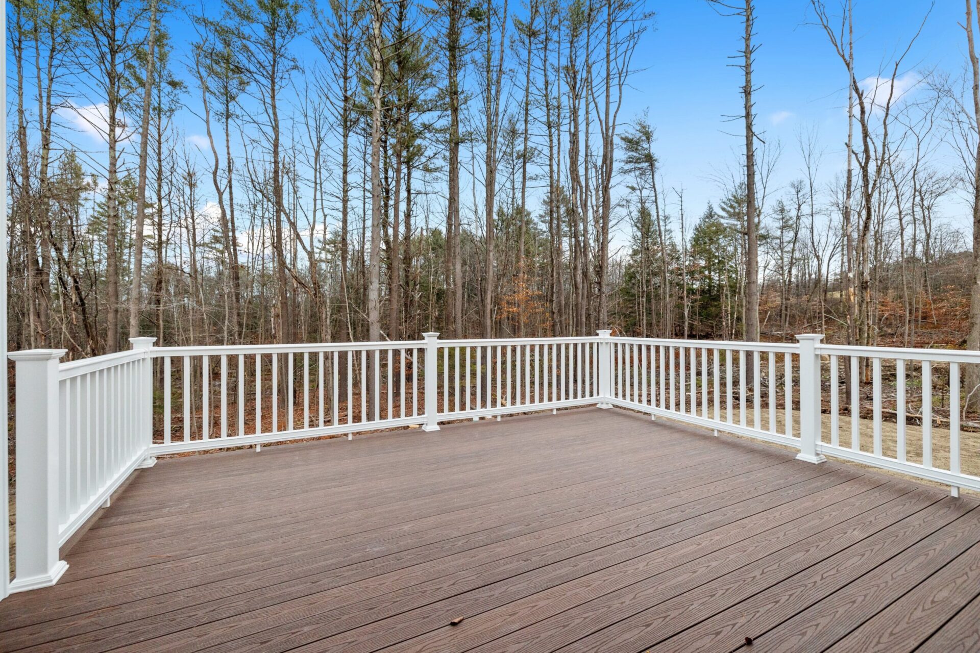 The,Decking,Boards,Of,A,Porch,With,White,Railings,In