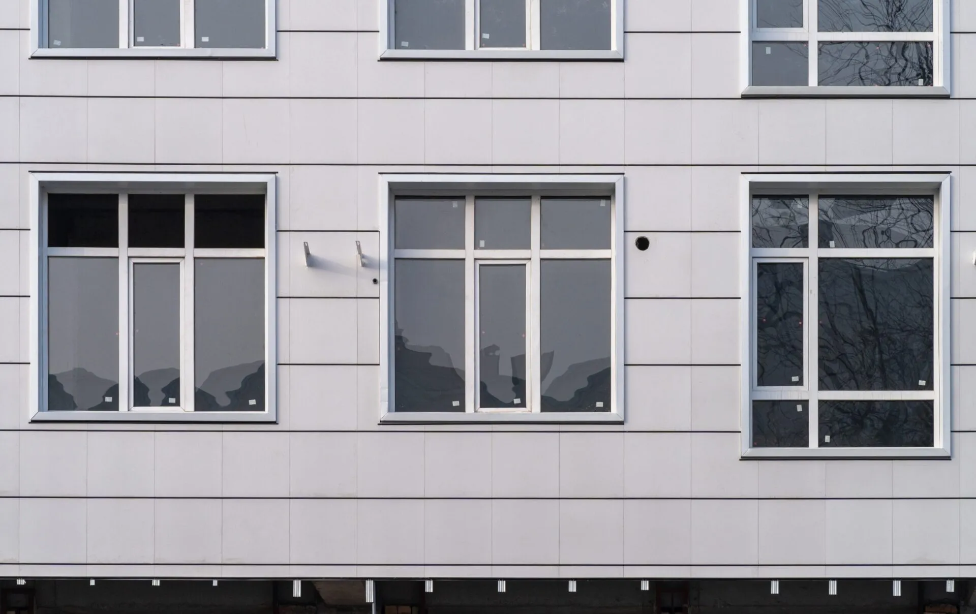 Several,Windows,On,The,Wall,Of,A,Building,With,A