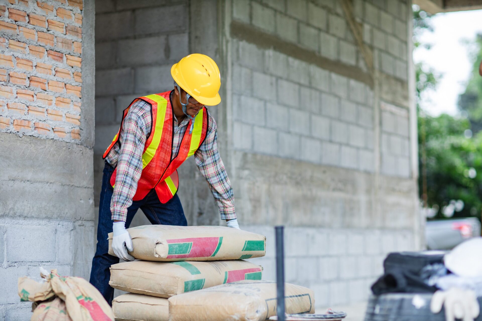 Worker,Is,Unloading,The,Bags,Of,Cement,An,Apartment,Is